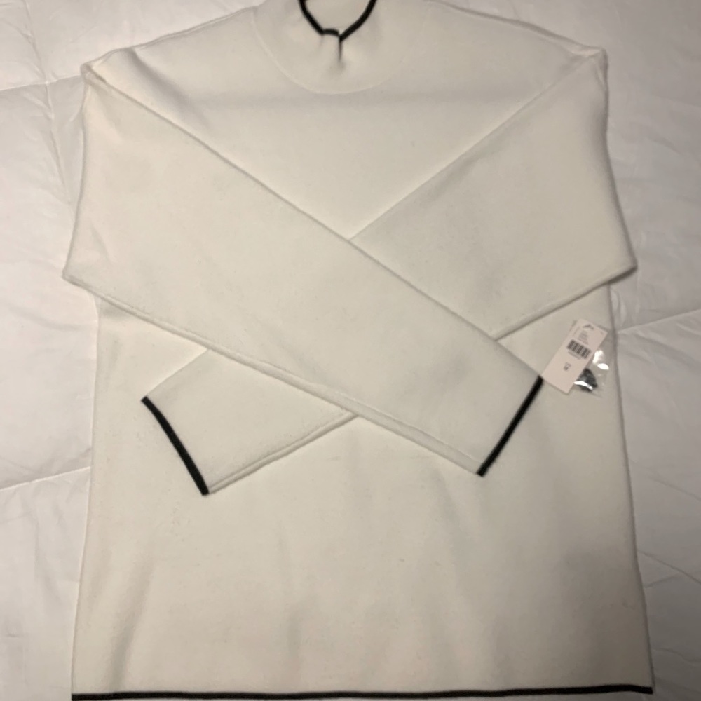 Ivory sweater with black trim